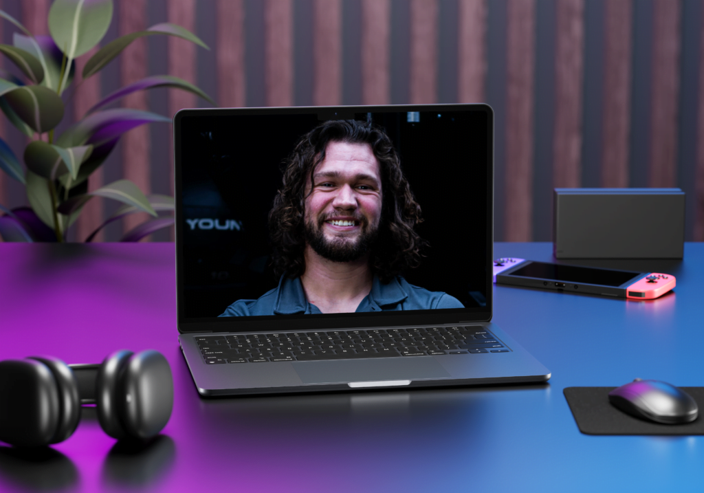Coach meeting with online personal training client through computer
