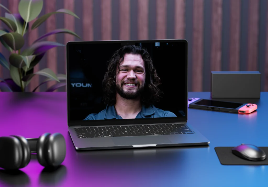 Coach meeting with online personal training client through computer