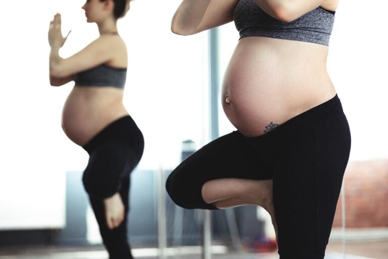 Pregnant woman strength training during pregnancy with prenatal personal training